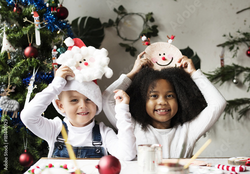 Happy kids with their DIY Christmas projects photo