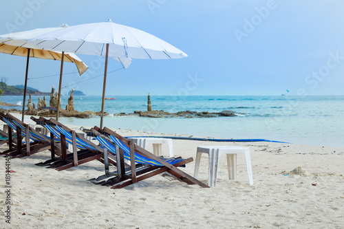 Sun loungers and beach umbrellas on the beach At Koh Samet Thailand.