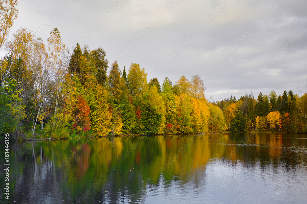 Autumn. Reflection of trees in water Autumn. Reflection of trees in water