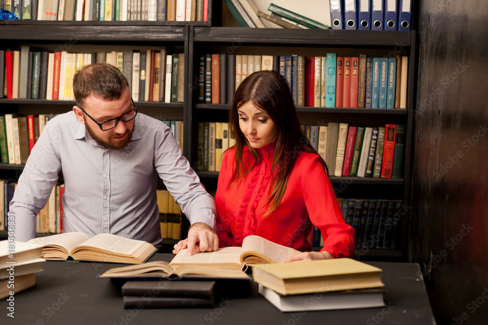 a man with a woman in the library prepared for the exam read books a man with a woman in the library prepared for the exam read books
