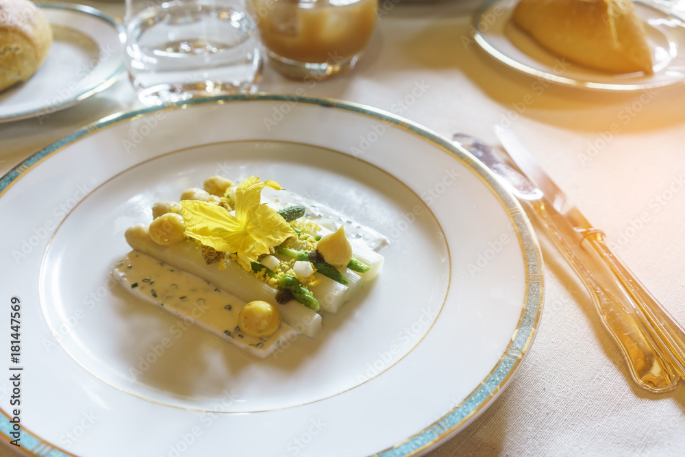 Delicious white asparagus with mimosa egg and goat cheese for starter Delicious white asparagus with mimosa egg and goat cheese for starter