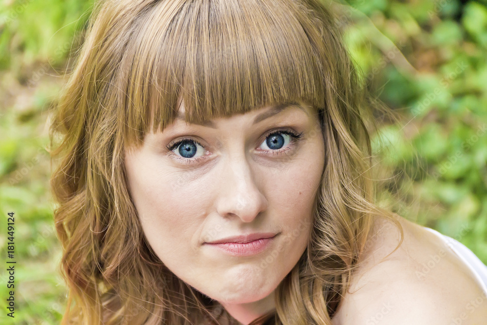 Young woman with big bulging blue eyes