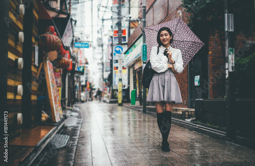 Sticker Beautiful japanese girl walking in Tokyo
