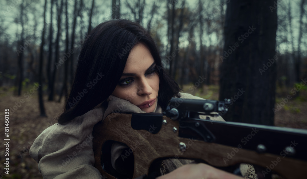Αυτοκόλλητο Girl with a crossbow in the forest. Autumn forest.