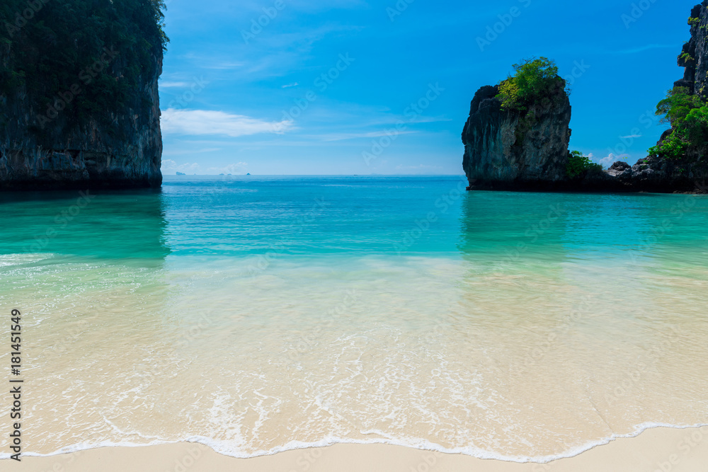 sea wave of a calm turquoise sea on a white sand beach in Thailand