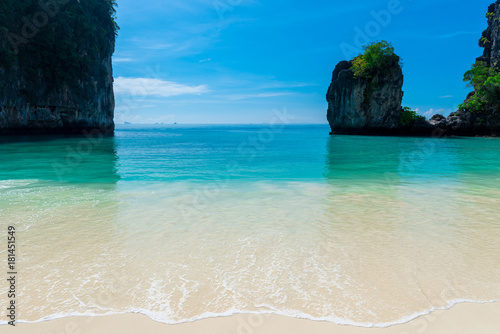 sea wave of a calm turquoise sea on a white sand beach in Thailand