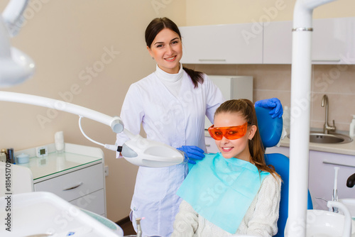 Beautiful girl smiling at the dentist.