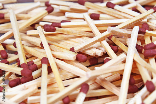 Match sticks with brown heads in a row. Fire Matches texture pattern concept. Stacked matches as background photo.