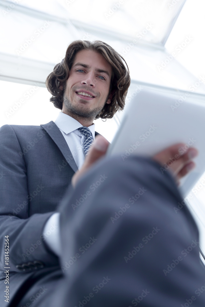closeup .businessman working on digital tablet closeup .businessman working on digital tablet