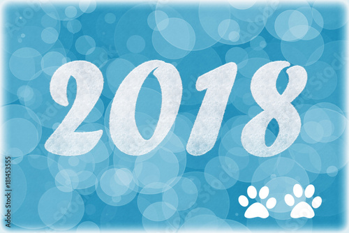 Beautiful Christmas banner, desktop wallpaper with numbers in ionita snowflakes and inscription 2018 and dog footprints
