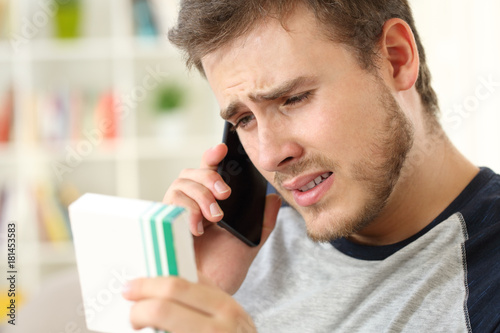 Worried man calling doctor asking about medicines