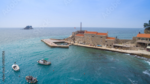 pier, house with red roof, sea and boats aerial view