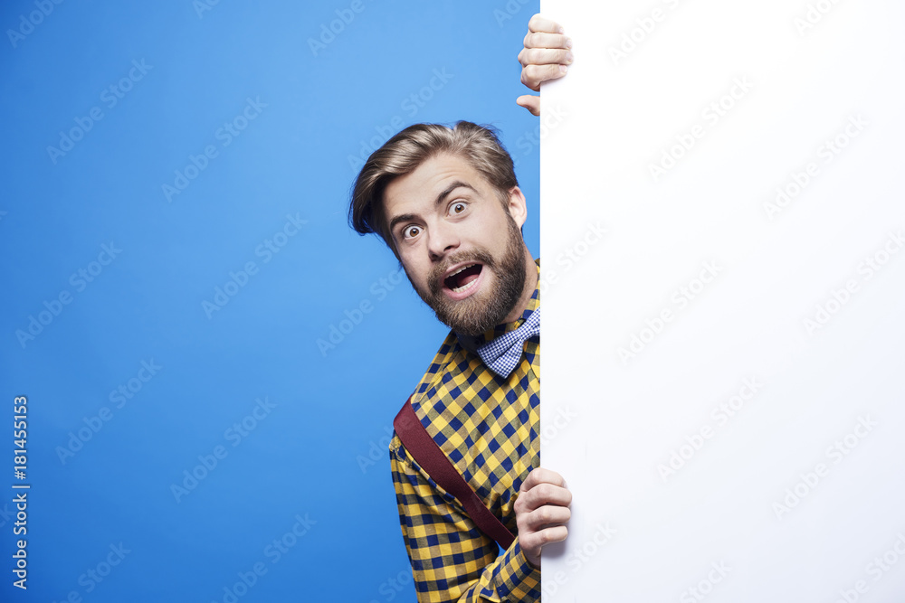 Portrait of shocked man peeking Portrait of shocked man peeking