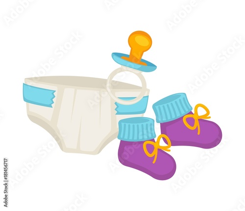 Baby diapers, knitted booties and small pacifier set