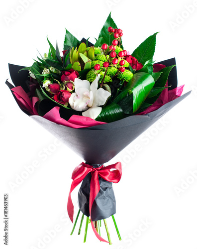 Fototapeta Naklejka Na Ścianę i Meble -  Beautiful bouquet of red, white and green flowers wrapped in dark craft paper isolated on white background. For Mothers and Valentines Day