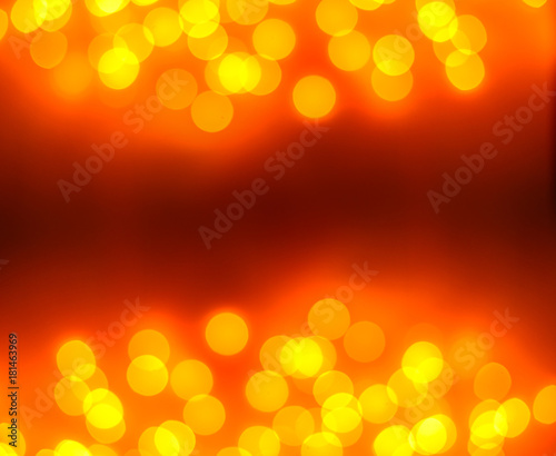 Christmas background. Festive gold abstract background with bokeh defocused lights