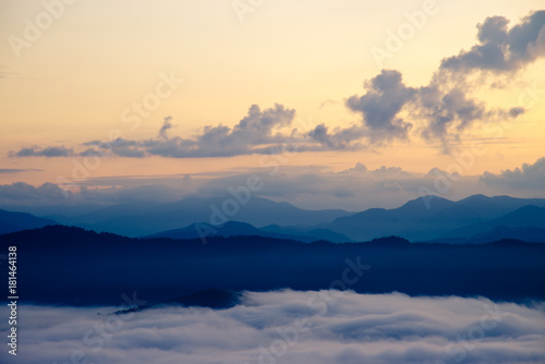 Beautiful Sea of mist in the morning with layer of mountain and sunrise