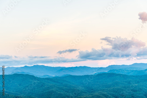 Green layer of forest mountain in the evening for Doi Pha Chu in Thailand