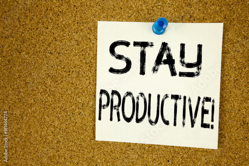 Conceptual hand writing text caption inspiration showing Stay Productive. Business concept for Concentration Efficiency Productivity written sticky note reminder cork background copy space photo