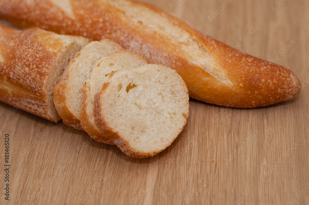 French loaf on a wooden board with space for text