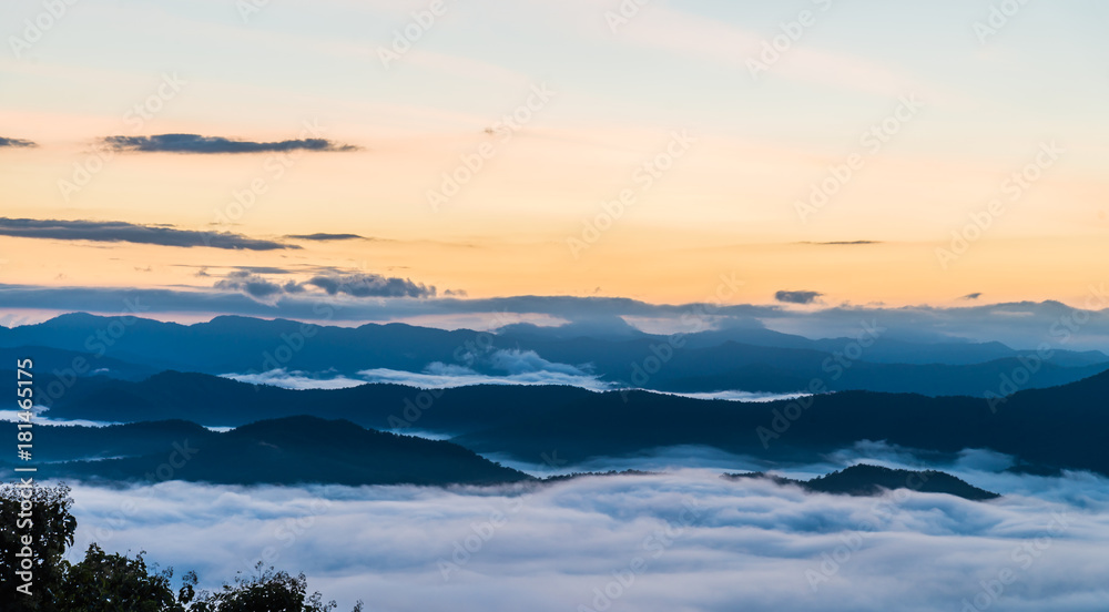 Beautiful Sea of mist in the morning with layer of mountain and sunrise scene