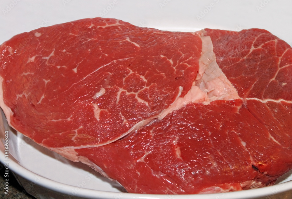 Lean cut of Beef in casserole dish ready for cooking
