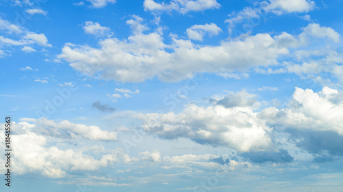 Beautiful blue sky with white fluffy clouds, texture. Nature weather background