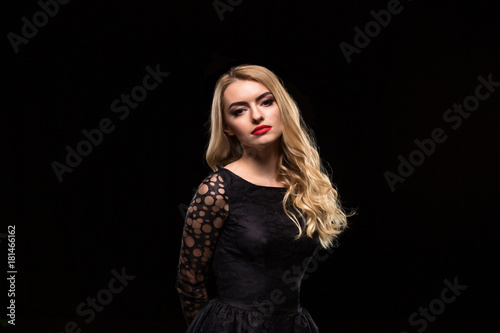 Beautiful Curly Hair. Female Beauty Model With Perfect Makeup, Gorgeous Volume And Blonde Hair Color.