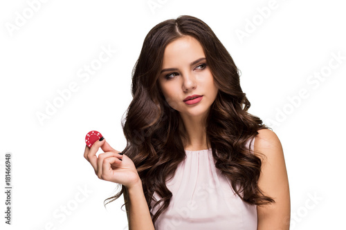 Sexy curly hair brunette posing with chips in her hands, poker concept isolation on white background