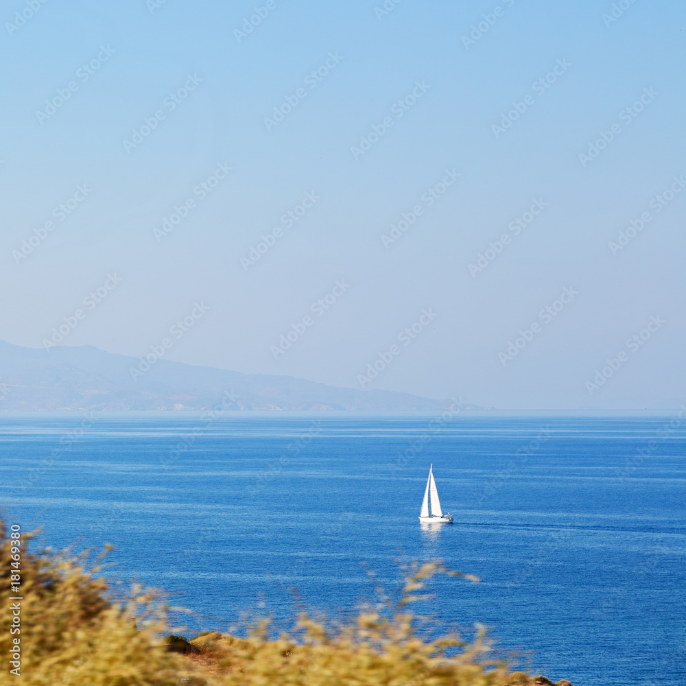 hill and rocks on the summertime beach in europe greece santorini island