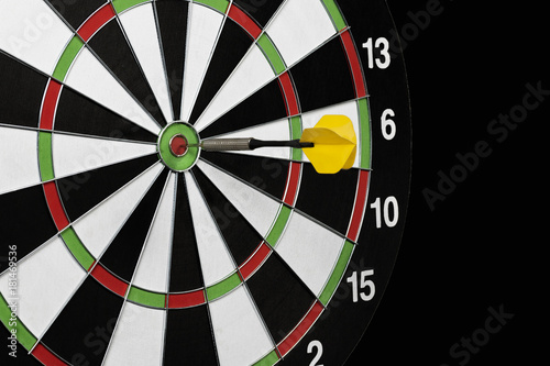 game of darts on a black background isolation