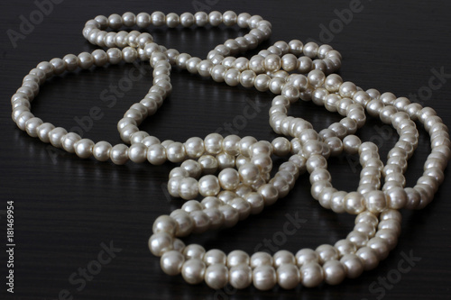 White pearls on a black