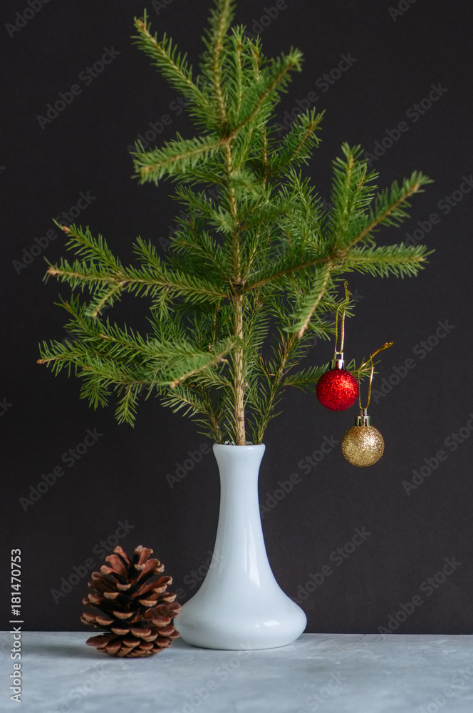 Fir tree branches with christmas balls in a vase. Still life. Stock Photo |  Adobe Stock