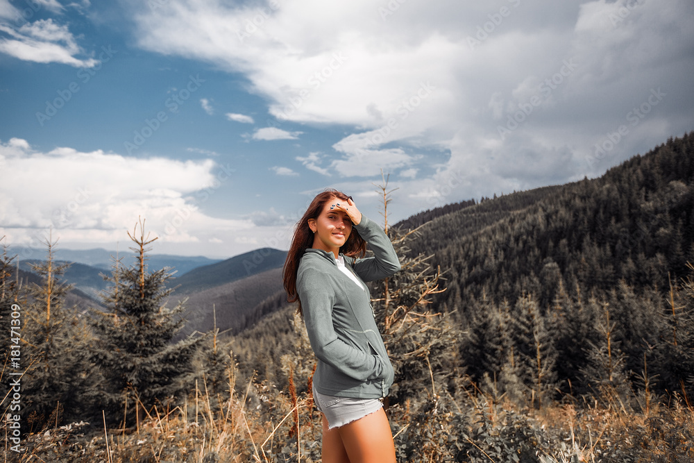 Outdoor close up portrait stylish hipster girl behind amazing mountains landscapes,sexy girl hiking,female in a mountains, girl in casual wear, tan, attractive, success, happy girl, emotional portrait