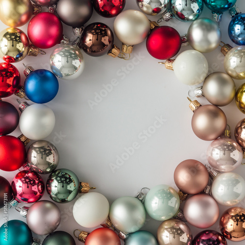 Creative layout made of Christmas bauble decoration. Flat lay. Holiday background.