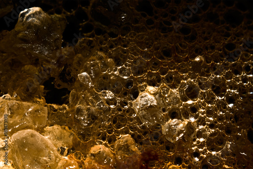 Sugar crystals in coffee foam macro