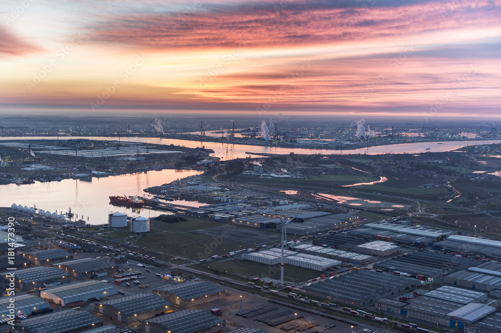 View on port of Antwerp before sunrise with Van Moer Logistics in the foreground