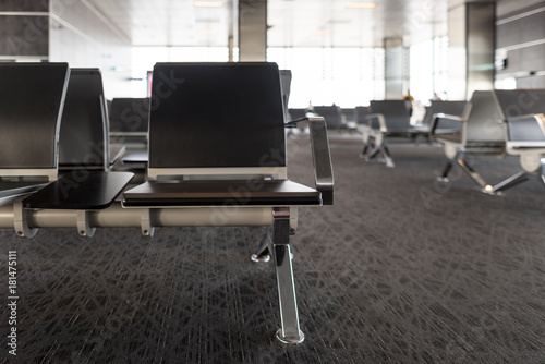 Empty chairs in the departure hall at airport , railway station. Travel and transportation concepts