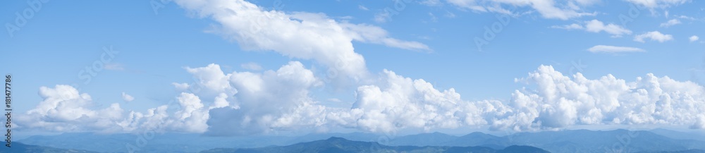 Panorama shot, Beautiful white clouds on blue sky. View from high mountain at Doi Pha Tung, Chiangrai, Thailand, Lao.