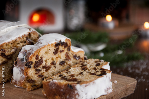 Sliced Christmas Stollen. Traditional german christmas cake with dried fruits and icing sugar