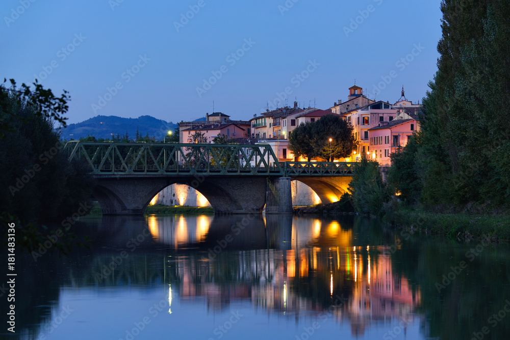 Old city reflection in Tevere river, Umbertide, Italy