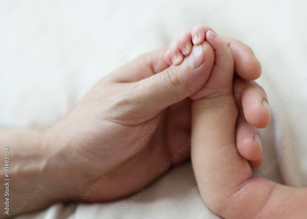 the hand of the baby in the father's father's hand the hand of the baby in the father's father's hand