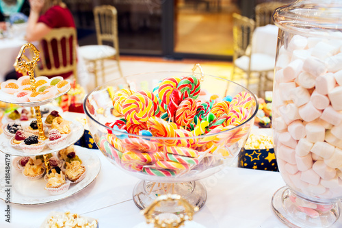 Colorful lollipops on a festive table