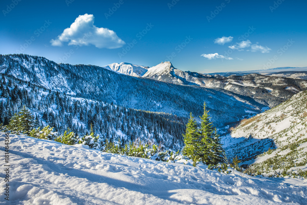 Obraz premium Mountain peak Giewont from between hillocks defile, Tatra mountains, Poland