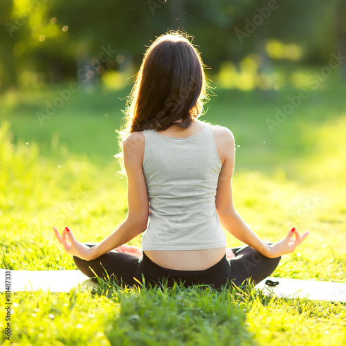 Woman practicing yoga outdoors