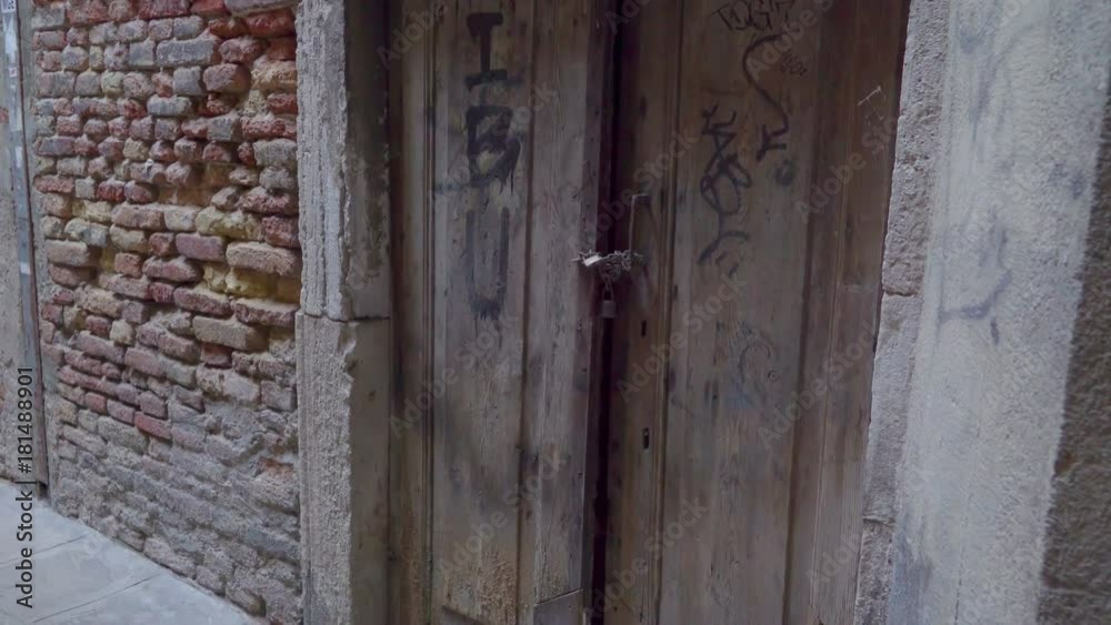 14747_A_big_wooden_door_being_locked_by_a_chain_in_Italy.mov