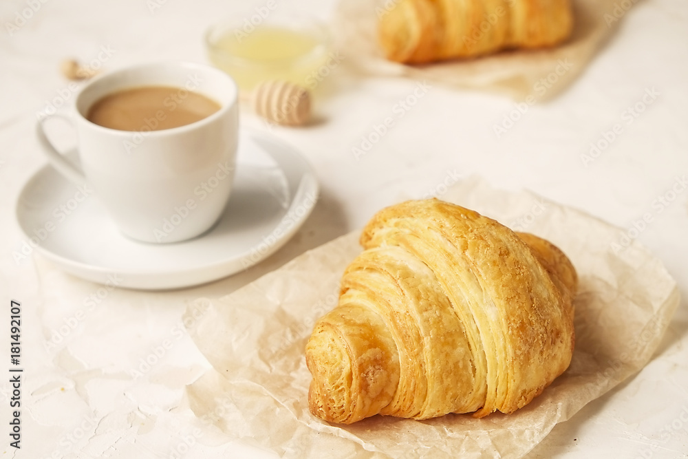 French breakfast with fresh croissants, raw honey and cappuccino. French breakfast with fresh croissants, raw honey and cappuccino.