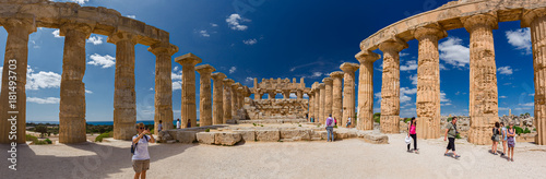 Some tourists visiting the ancient Greek temple in Selinuntea, Sicily, Italy. photo