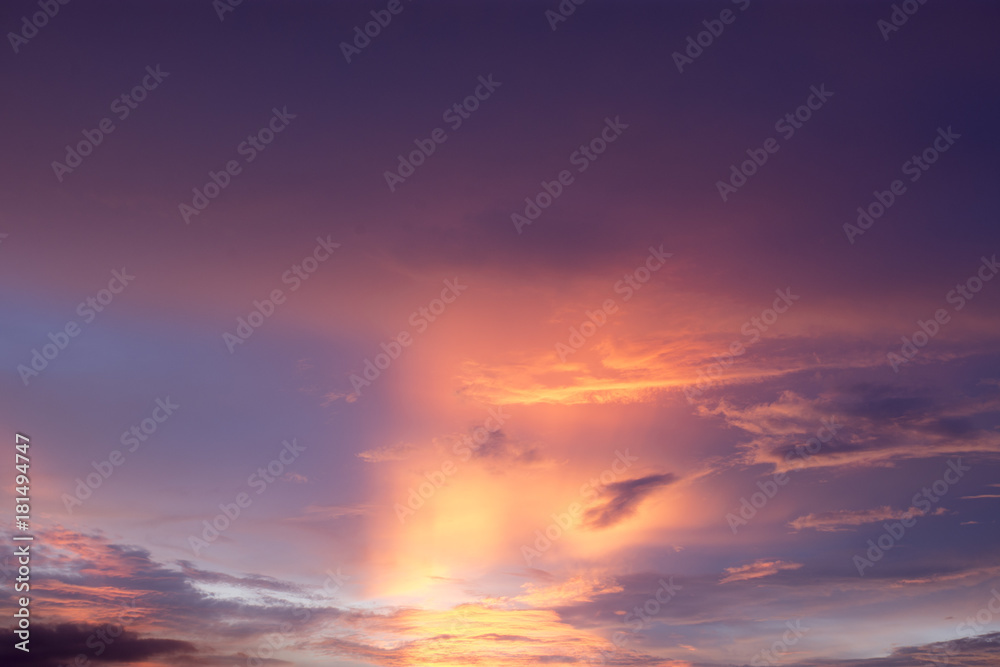 Orange and purple twilight sky stretched with cloud in one of summer day