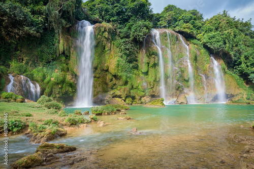 Amazing Ban Gioc waterfall flow down fluted in Cao Bang province  Vietnam.  Ban Gioc waterfall is one of the top 10 waterfalls in the world and along Vietnamese and Chinese border